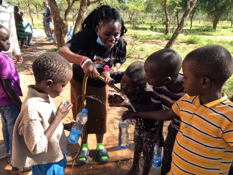Children drinking from a clean water well